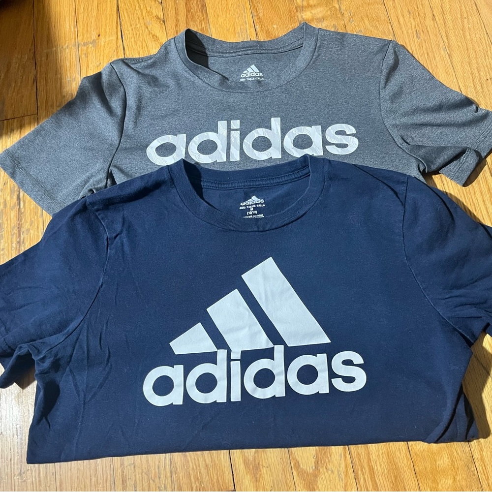 Grey Adidas is Dry fit never worn ; Blue is cotton worn a few times